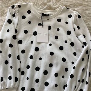White and black polka dot sweater.